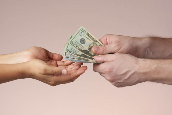 Hands giving money